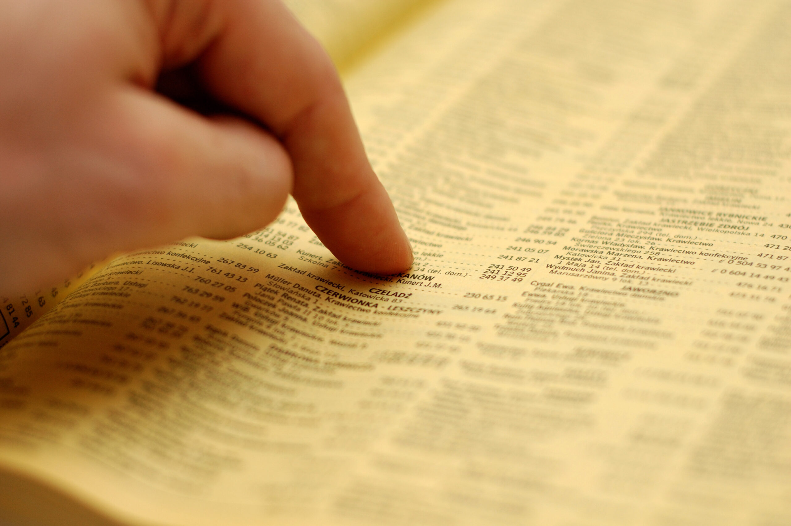 Phone book and a hand